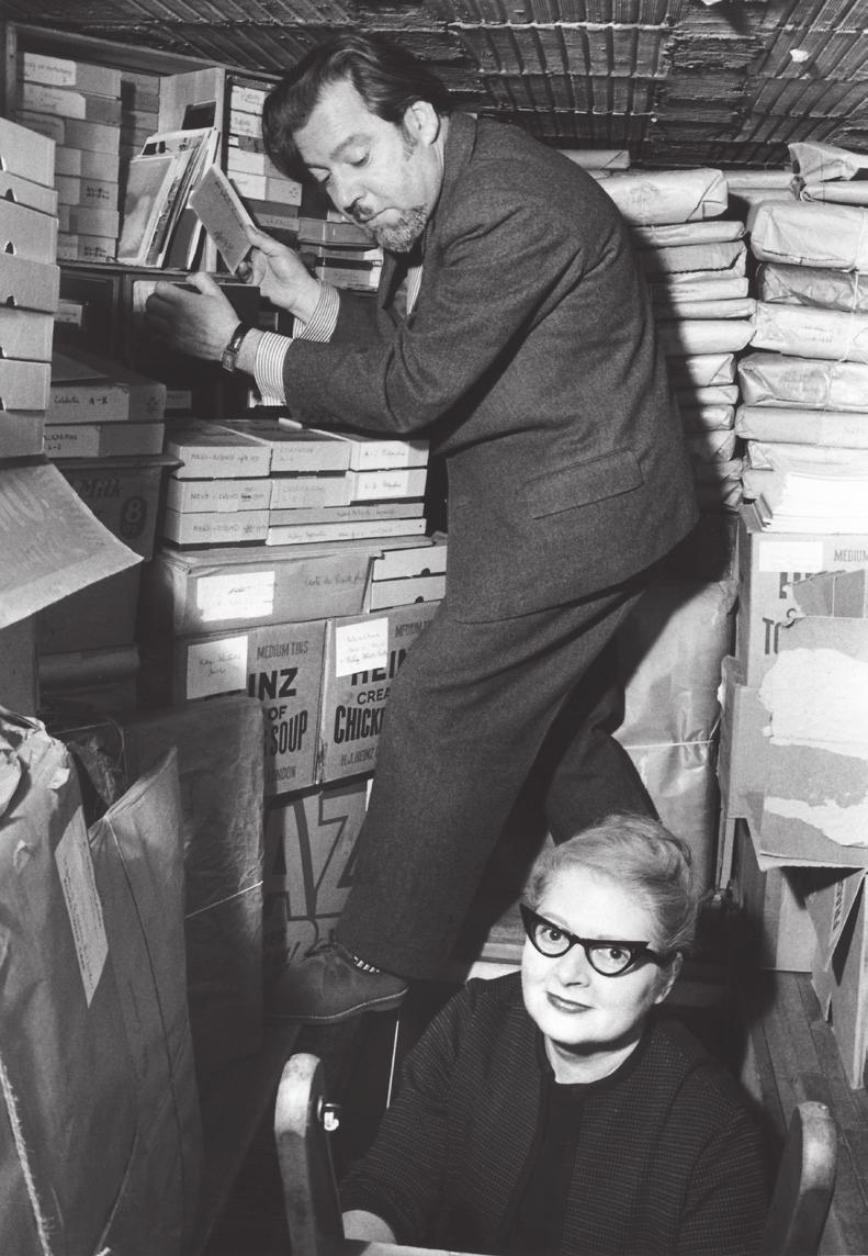 Vogue House, Helmut and Alison Gernsheim surrounded by their collection, stored in the attic of their London