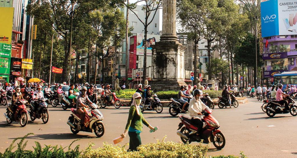 Mopeds zoom by in Ho Chi Minh City s District 10, the neighborhood where Loyola s Vietnam Center is located.
