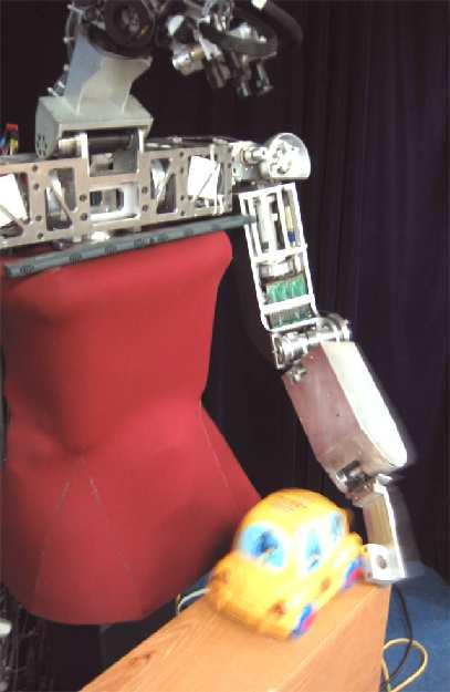 Middle: the robot s view when holding up an object.