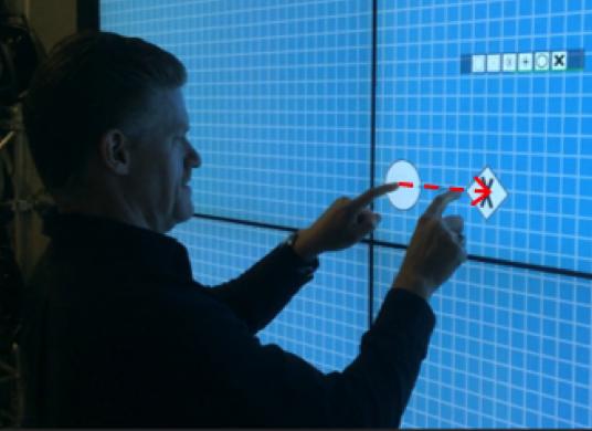 Interactive tabletops and walls can provide lay modelers with an easy to use possibility to manipulate process models as they provide a direct means of interacting with the displayed material [4].