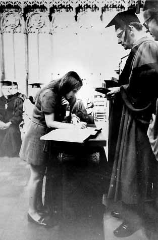 [13] Photograph of Alyson Adler 73 and Professor Rex Neaverson at Matriculation, October 1969 The photograph shows Alyson Adler 73 signing the Matriculation Register at ceremonies held in the Chapel