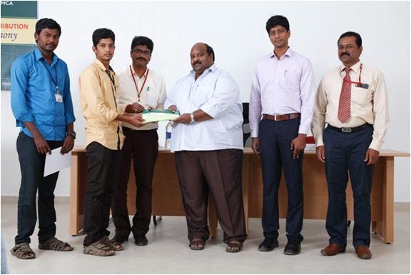 Sukumaran is honoring the student R.Muthumanickam of III MCA for winning first prize in the event of poster designing Our honourable Vice Chairman Mr.R.S.K.Sukumaran is honouring the students M.