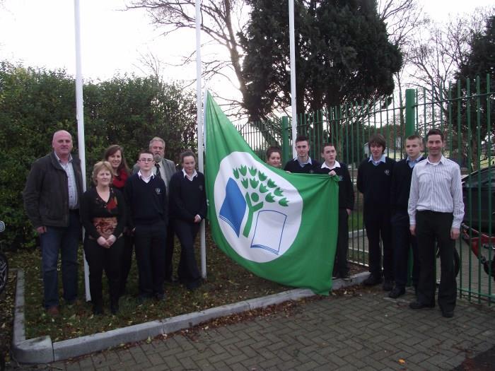 Nenagh College raising their first green flag Pictured is the guest of honour Mr. Charles Stanley Smith, An Taisce, who addressed the assembled student body.