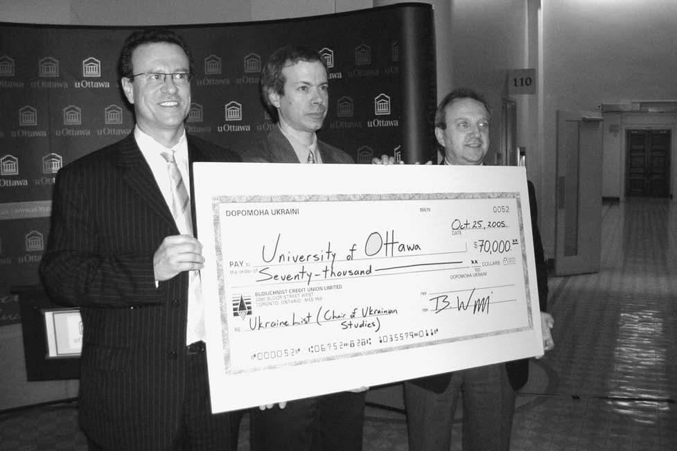 20 THE UKRAINIAN WEEKLY SUNDAY, JANUARY 15, 2006 No. 3 Liberal MP Borys Wrzesnewskyj (left) presents a $70,000 donation for The Ukraine List to Prof.