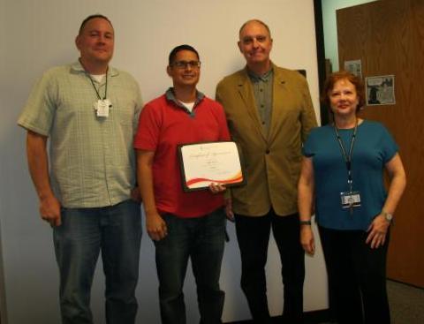 Pictured with Angel is his supervisor, Jeff Hawk (far left), Professor and Chair of PTRS, Dr.