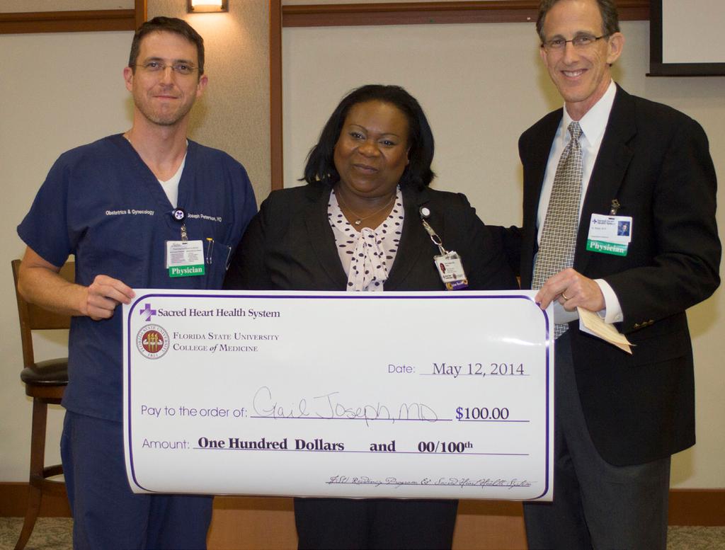 Peterson and Ripps present Dr. Gail Joseph with the OB-GYN award. 2014 Research Night held at Sacred Heart Hospital Pediatric Resident Dr.