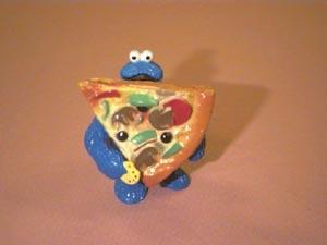 Cookie Monster replied that as soon as he finished his cookie, he would start eating the pizza, Picture 1.