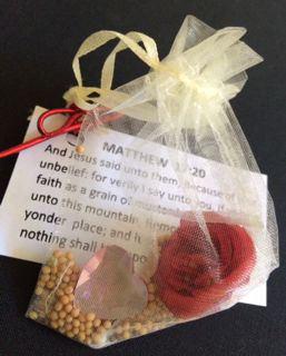 containing a red rose, a heart, and mustard seeds at the bottom. Tied to the sachet was the verse Matthew 17:20.