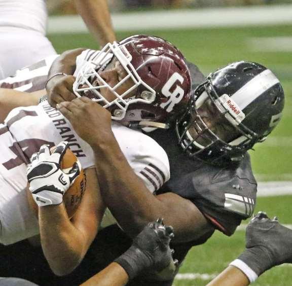 Photo: Ron Cortes /For The Express-News Steele defensive tackle Josh Croslen takes down Brant Kuithe from Richmond Cinco Ranch during their state semifinal playoff game at the Alamodome on Dec.