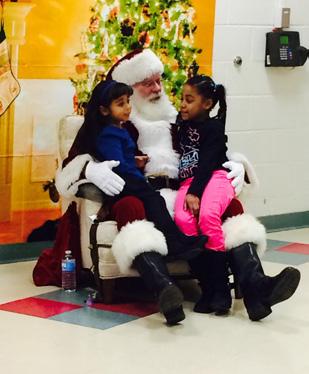 The Gift of Giving (Continued) SANTA GOES TO SCHOOL What a joyous scene it was when Santa visited the HMTCA café on