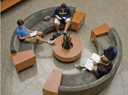 Convert existing library into a student union/media center. Disperse food service distribution around campus and create a quad that is more conducive to student interaction.