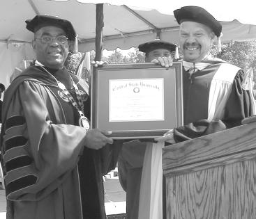 Central State University President John W. Garland and Tom Joyner share a moment of history.