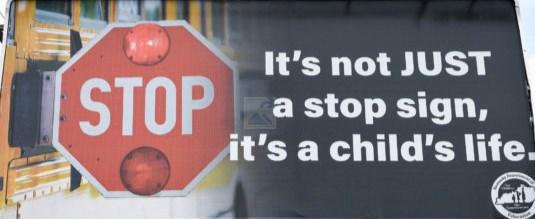 You must remain stopped until the stop signal arm is no longer extended and the flashing lights are