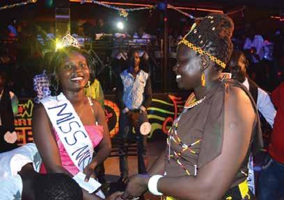 Brenda Epur, Miss MKU-Lodwar Campus 2015 (left) is congratulated by Ms Pauline Akiru, the
