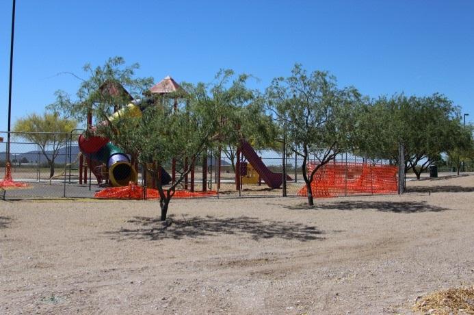 Improvements to the outdoor environment such as trees, fencing, lighting, and outdoor benches were designed to make school