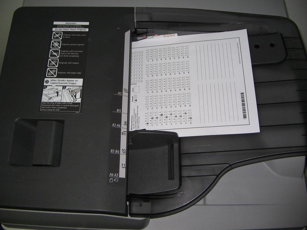 document feeder on the top of the copier.