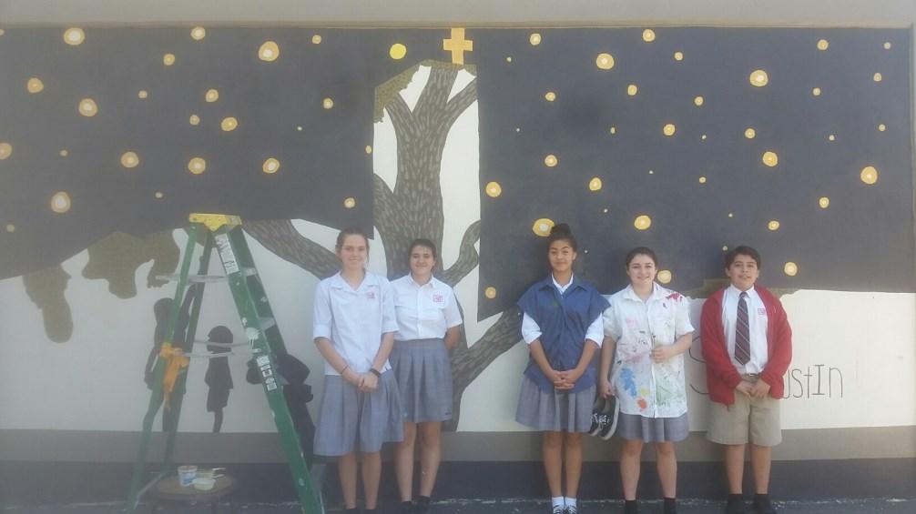 Harden and her art elective students are making good progress on the San Antonio Street mural. Stop by and check it out!