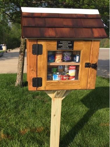 This box is located in the parking lot of the church and is similar to the little free libraries in the area.