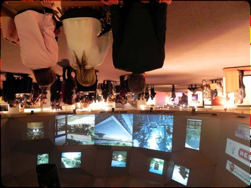 A Dome show (left) that features the images from the exhibit can be seen on various screens with traditional Japanese music playing in the background at the reception.