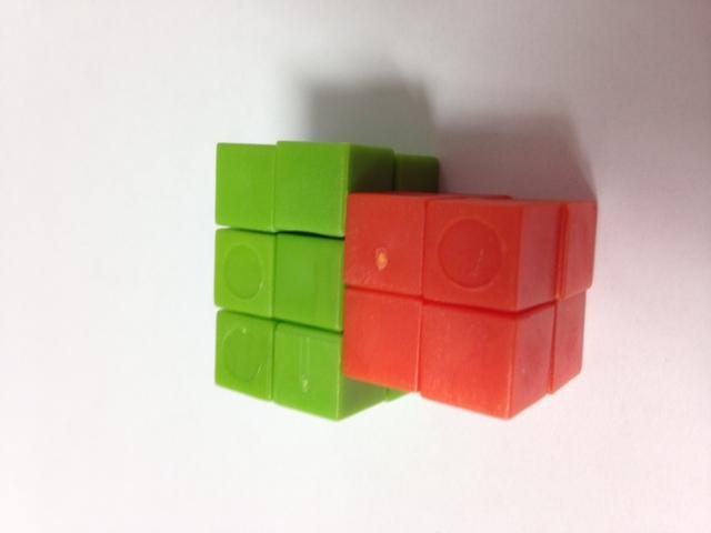structures, and then find the total volume. T: Partner A, use one color cube to build a structure that is 3 cm by 2 cm by 2 cm.