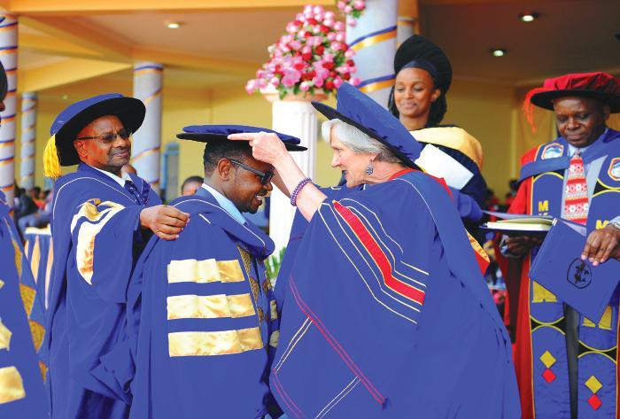 SCHOOL OF ENGINEERING, ENERGY AND THE BUILT ENVIRONMENT seebe@mku.ac.ke Chancellor Prof. Victoria Wulsin confers a Doctoral degree to one of the graduands at a past ceremony.