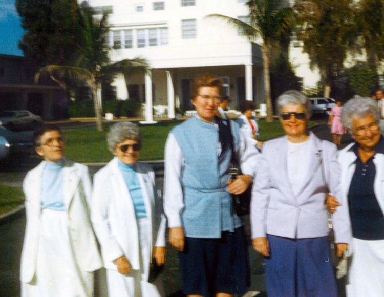 Left: Standing in front of Rosarian Academy, West Palm Beach,
