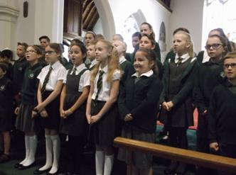 Children in Years 1 and 2 performed harvest poems together.