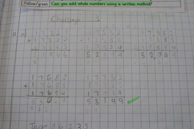 Children apply their knowledge of the written method in a range of different contexts E.g. in this example where children were investigating three consecutive numbers which make a given value.