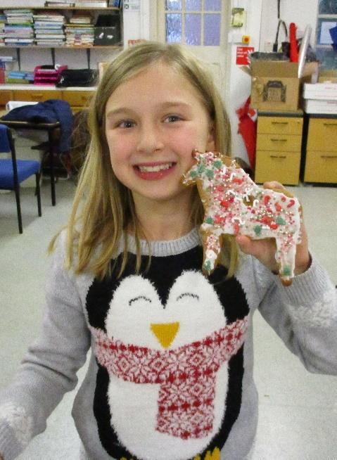 After baking they then iced and decorated their biscuits, before attaching a