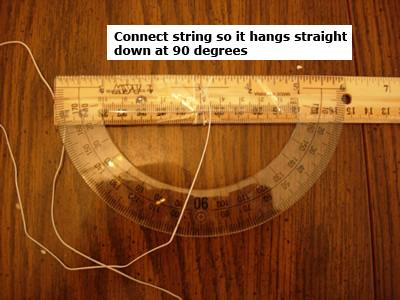 Figure 2: A close-up view of the string connection. In order to use the device, have the student stand with the ruler perfectly level at eye level.