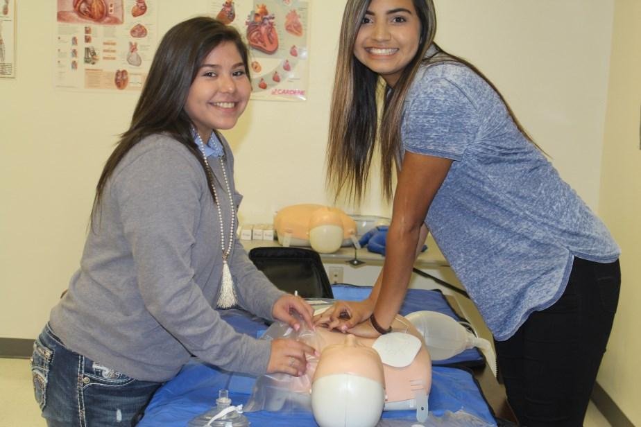 Adame, and Allan Marquez practicing CPR
