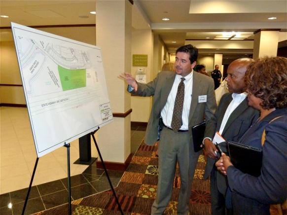 The informational stations included artistic renderings, conceptual layouts, comparable neighborhood integration, service benefits, traffic analysis, and related information for the proposed site.