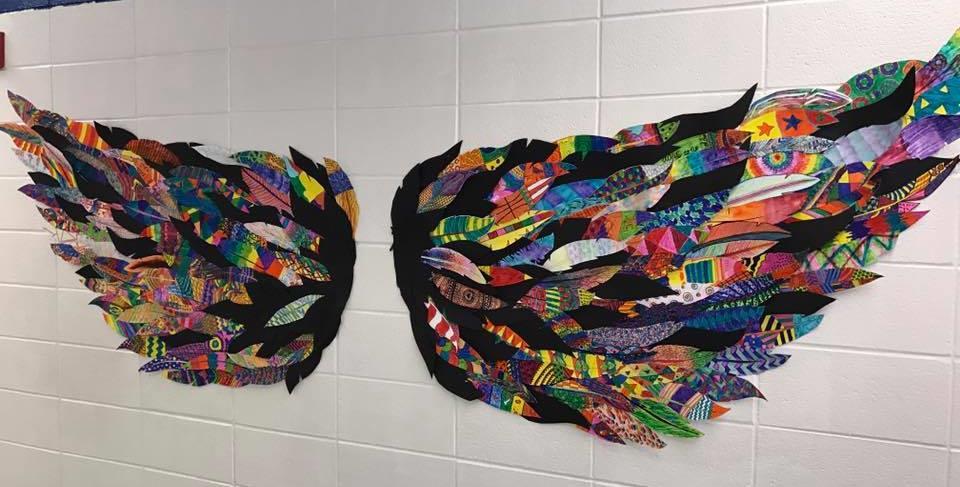 Students created a collaborative set of wings and they displayed them for others to