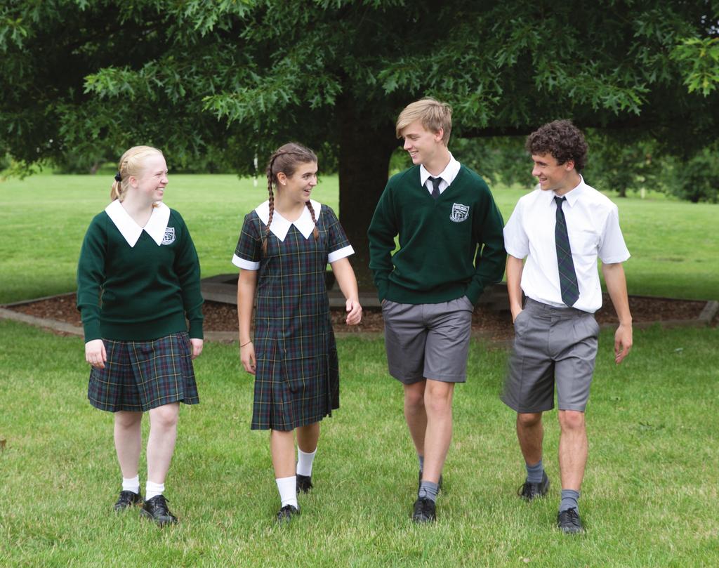 High School (Year 7-10) Summer Formal Uniform Girls: Summer tartan dress Green woollen jumper Green blazer Socks white short