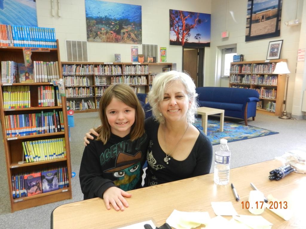 She only signed The Tale of Despereaux and Flora and Ulysses. I sat down to ask her some questions.