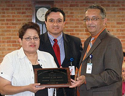 Emitte Roque, executive director of buildings and properties, named Eisenhower Senior High School as his department s Yard of the Month.