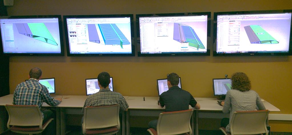 four BYU students working together to design an unmanned aerial vehicle (UAV) wing using NXConnect.