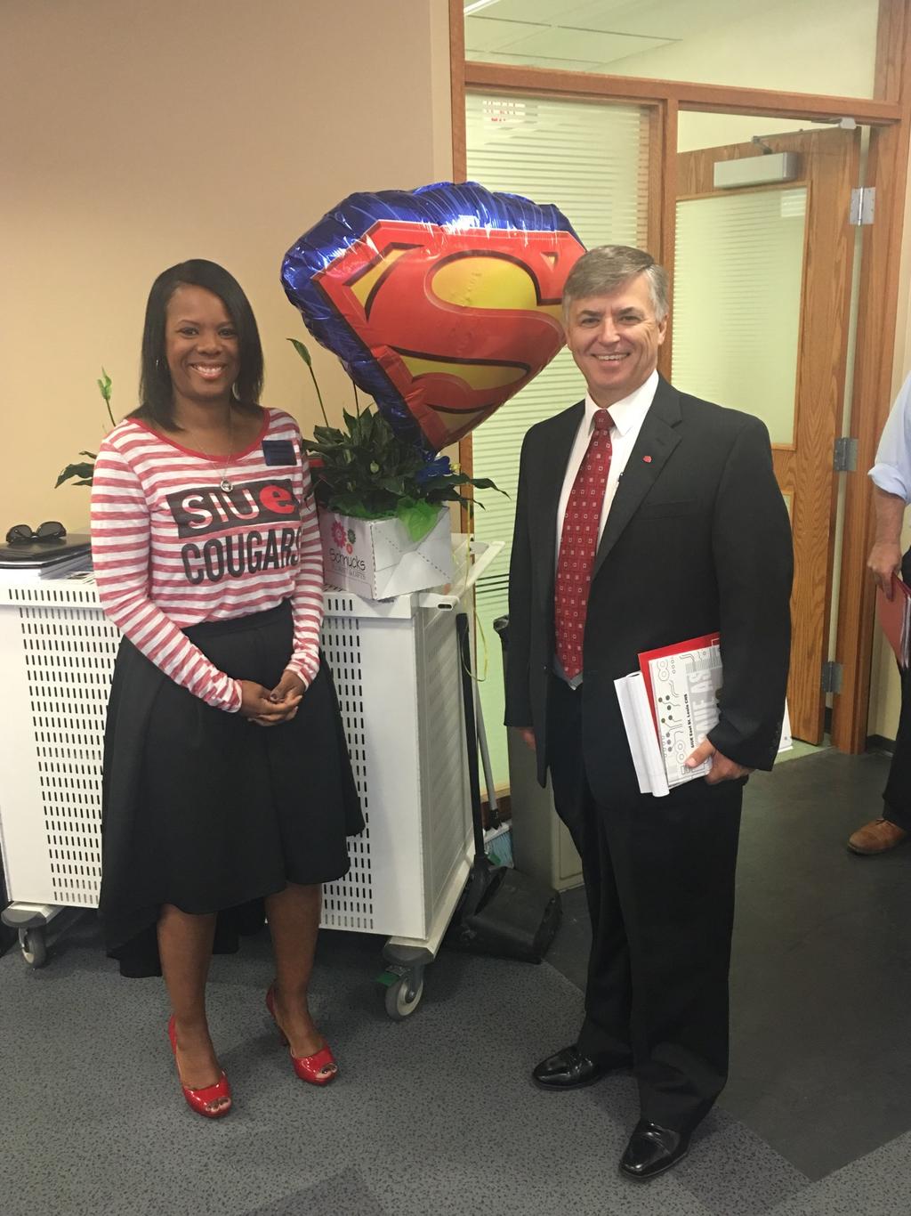 Chancellor Visits SIUE East St. Louis Charter High School This August, newly appointed Chancellor Dr. Randy Pembrook visited the SIUE East St. Louis Charter High School. He was presented with a peace lily and a Superman balloon.