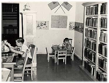 Irving Public Library, 1942-1951, rental space at 113 E. First Street. This photograph dates from the spring of 1942. Plagued with drainage problems, the lots were unusable until Mrs.