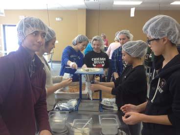 Mundelein High School Eight members of Mundelein FBLA travelled to the Feed My Starving Children facility in Libertyville, for Community Service Day on Saturday, February 15, as part of FBLA Week.