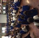 about our RE topic, Belonging, Father John explained to the children about Baptism and how we