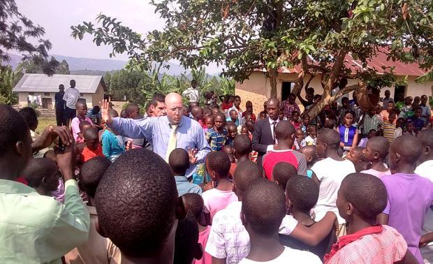 AARON WOMACK AND OTHER TEAM MEMBERS MINISTERING TO THE CHILDREN IN NYAKYIZINGA DONATING A SEWING MACHINE TO ONE OF THE FAMILIES IN NYAKYIZINGA On Monday 20 th, With all the children and teachers