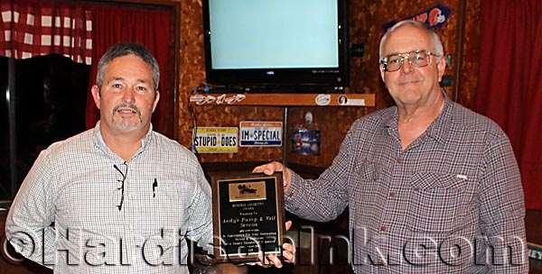 Inc. Arthur Bellot (right) presents a Business Longevity Award to Andy