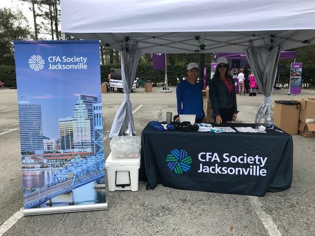 CFA Society Jacksonville manned a booth in the Runners Village at the finish line