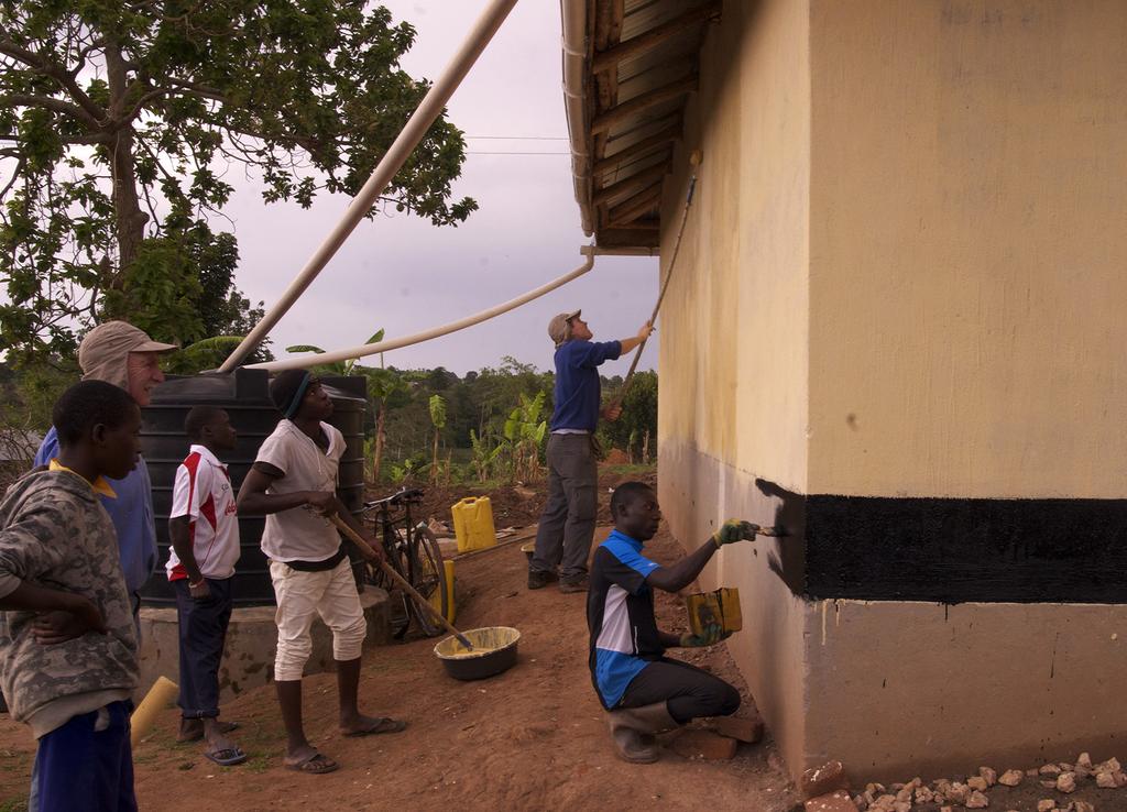 This year we hope to have enough funds to install a solar panel for lighting and make improvements to the toilet block. Repairs to the latrine at Maama Rose s. Painting Kilkenny House.