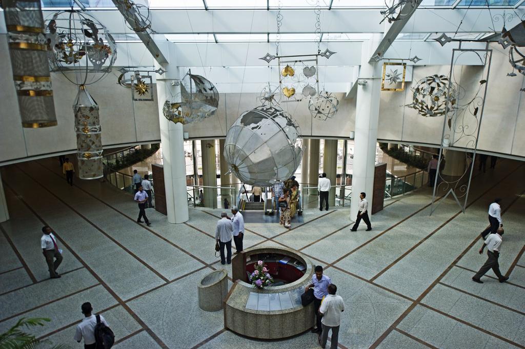 ABOVE: Traders cross the floor in the lobby of the World Trade Center, Colombo.