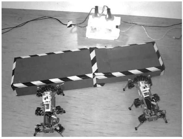 robot [Yanco and Stein, 1993] Small robots pushing a box towards a source of