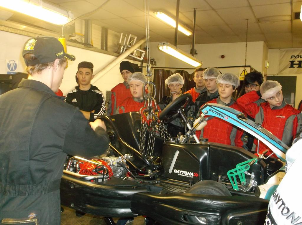 The day started with everyone dressing up in their racing suits. We then took a full behind-the-scenes of the workshop.