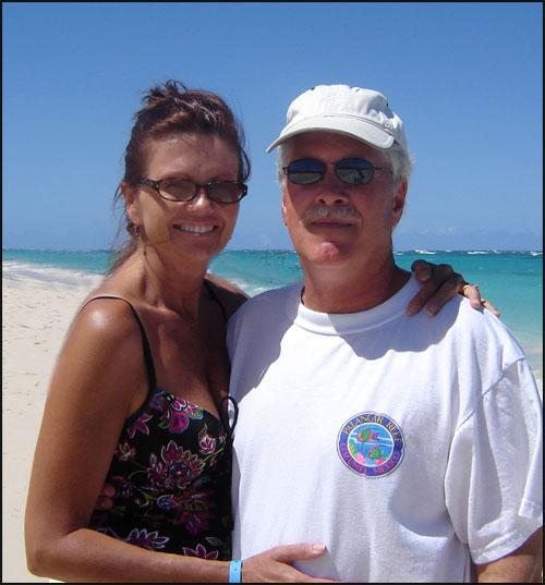 John and his favorite traveling companion, June, on the sunny beaches of