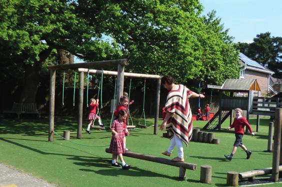 Mrs Hill must surely get a special award for her balancing skills on the Trim Trail - can you spot her in the playground photo below?